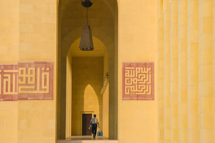 Entrance of Al-Fateh Grand Mosque in Bahrain with intricate designs.