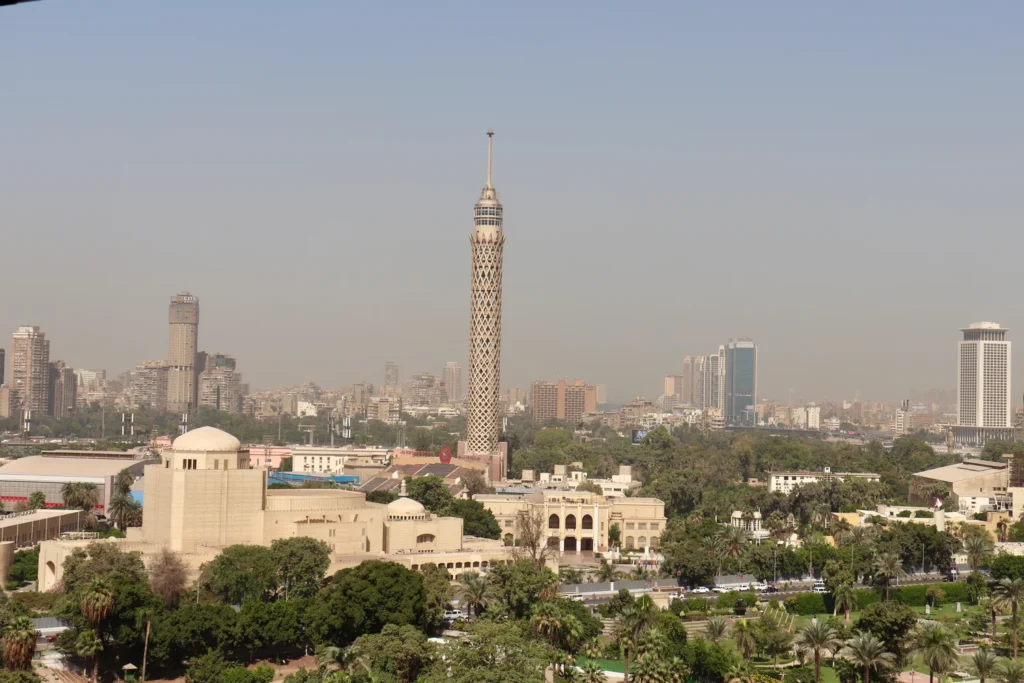 Cairo skyline featuring iconic tower and urban buildings.