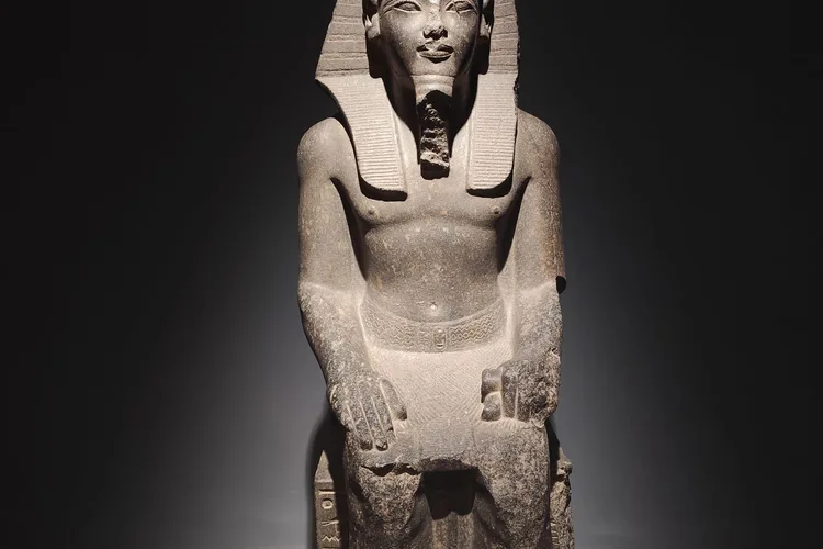 Statue of an Egyptian pharaoh displayed in a Luxor museum.