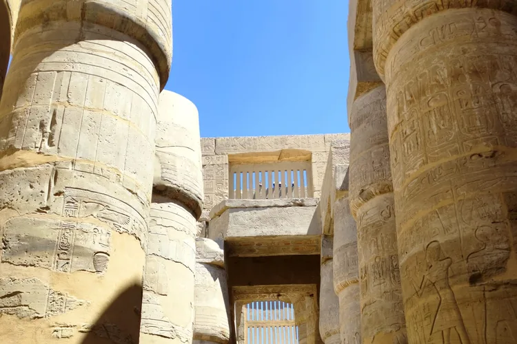 Colonnade with hieroglyph-filled columns at Karnak Temple, Luxor.