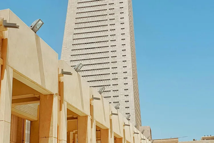 Kuwait National Museum building with modern architectural design under a clear blue sky.