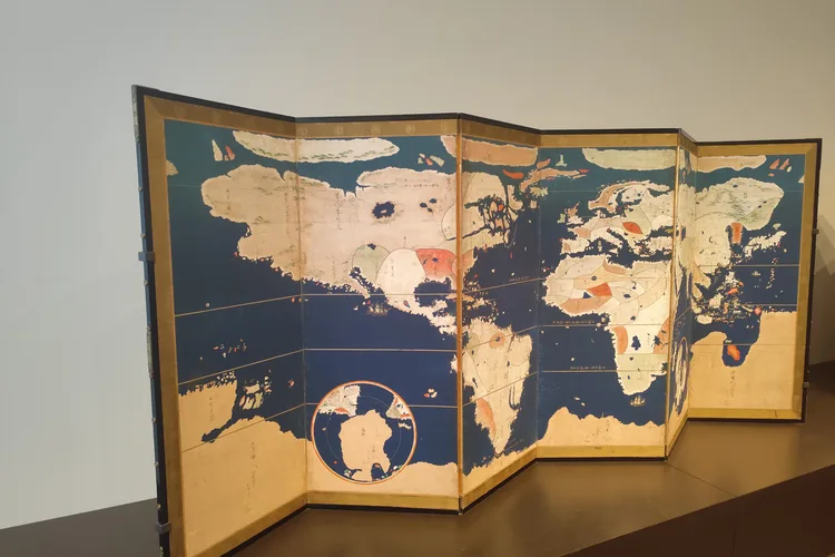 Historical world map display at Louvre Abu Dhabi museum