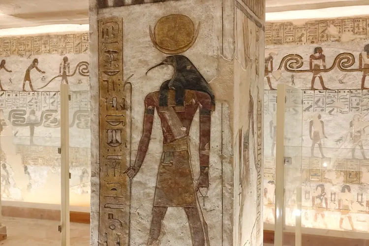 Ancient Egyptian hieroglyphs inside a tomb in Luxor, Egypt.