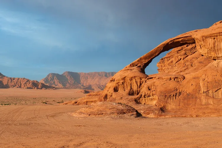 Natural rock formations and vast desert landscape in Wadi Rum, Jordan.