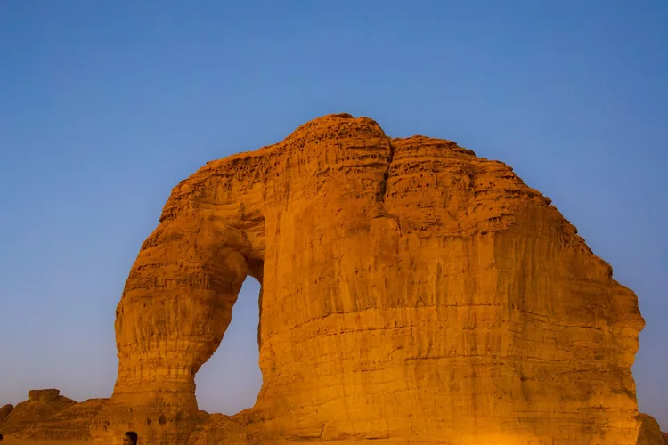 Elephant Rock at sunset in AlUla, Saudi Arabia, with clear skies.