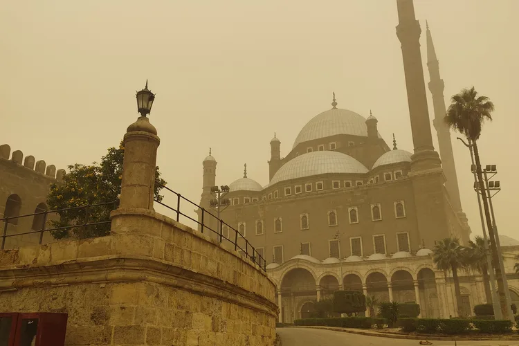 Cairo Citadel with the Mohammad Ali Mosque under a hazy sky.