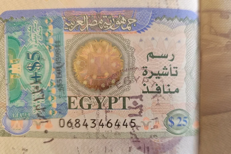 Egypt tourist visa stamp showing a $25 fee and Arabic text.