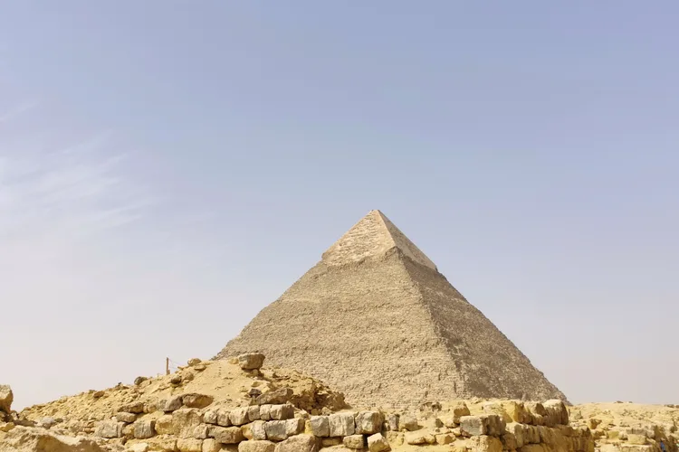 The Pyramid of Giza with a clear blue sky background.