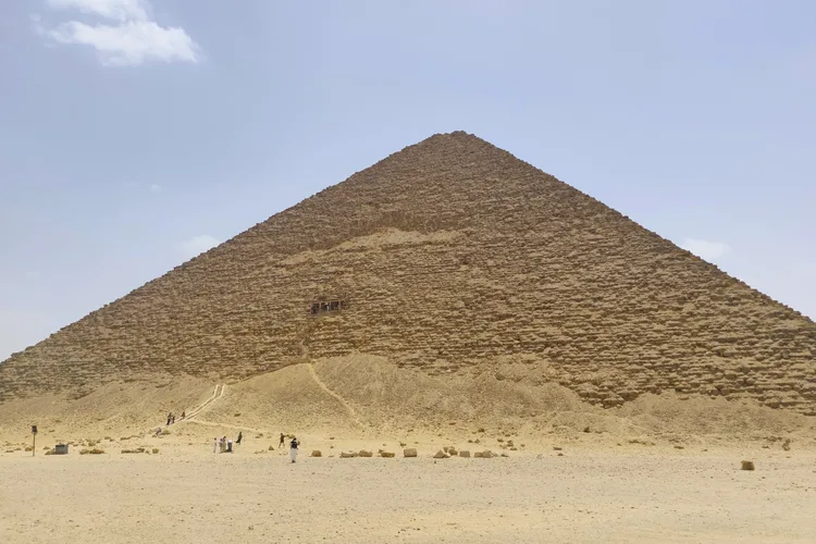 The Step Pyramid at Saqqara, Egypt under a clear sky.